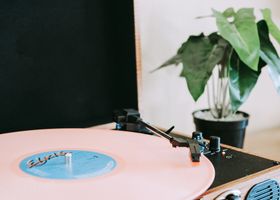 Records and headphones on a desk